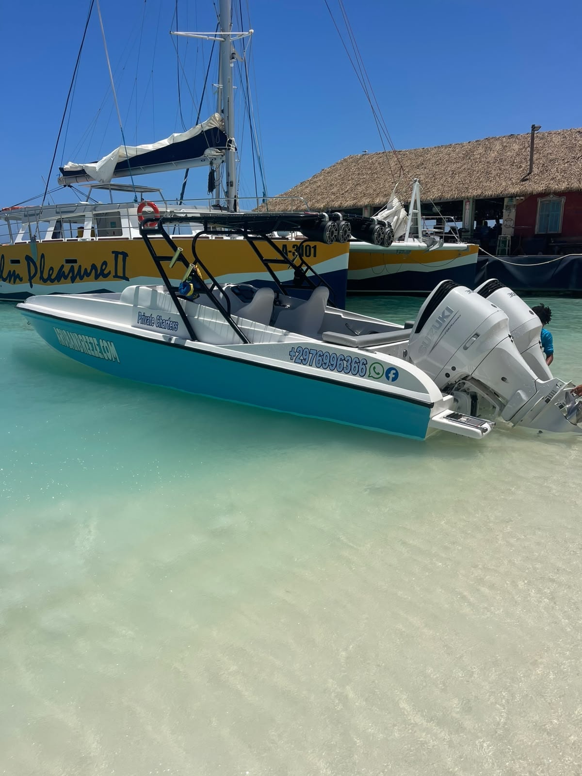 The Aruban Breeze boat pulled up on the beach, ready for guests to board