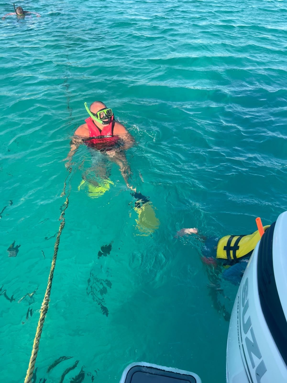 Snorkeling with an underwater scooter beside the boat