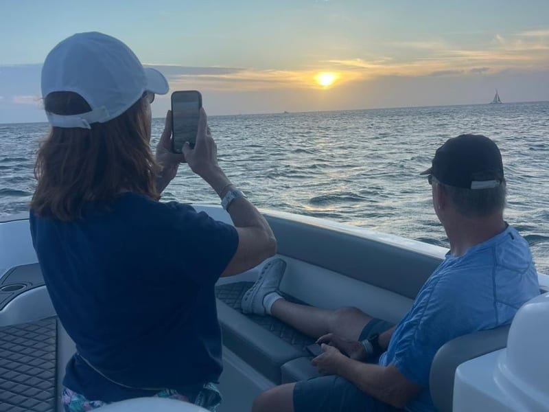 Guests watching the sunset from the Aruban Breeze boat